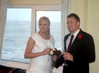 Storm batters seaside village as couple marry