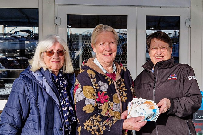 Sylvia Caldwell and Angie Payne-Hanlon with Looe RNLI’s Lifeboat Visits Officer, Carol Foster, outside Saltash Sailing Club