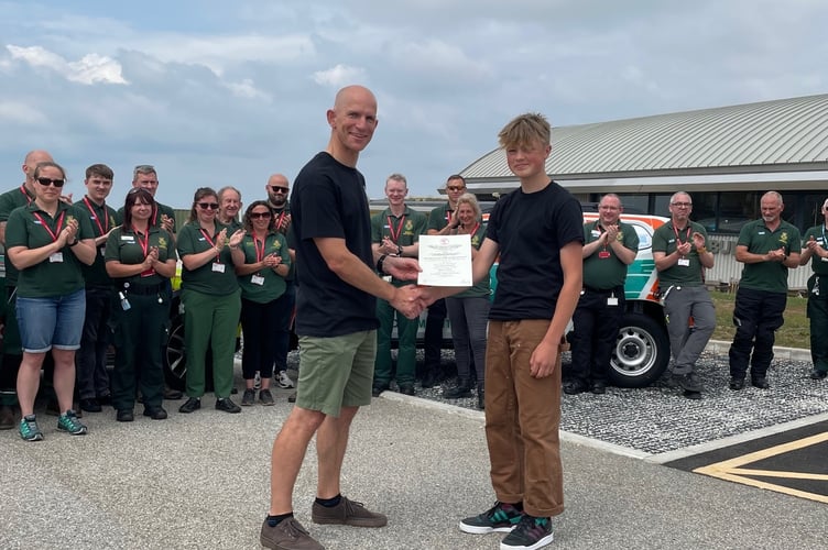 Oscar presenting Mike with a Royal Humane Society Award for his quick-thinking actions which helped save his life