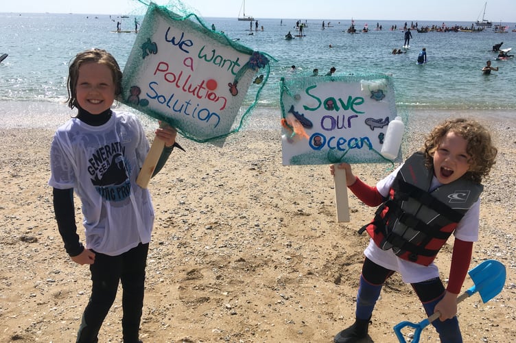 Two young supporters of the SAS mass paddleout at Gyllyngvase Beach, Falmouth (Image: Richard Whitehouse/LDRS)