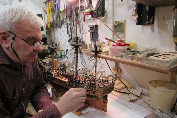 A Ukrainian man is building model ships fit for show in a museum from the middle of a war zone being constantly bombed. Vitaliy Vribel, 64, (pictured making one of his models) is currently making a model of Ernest Shackleton's ship Endurance after being commissioned by the Shipwreck Treasure Museum, in Charlestown, Cornwall. See SWNS story SWPLshipwreck. Shackletons ship was famously crushed in ice during his bid to cross Antarctica more than a century ago and Vitaliy's model will be shown in the museum as part of their exhibition about the polar explorer once completed and it "somehow finds its way from Ukraine to Cornwall", the museum said. The retired engineer is carefully creating the ship in the loft of his fourth floor apartment in Dnipro - a city in Ukraine that is constantly being bombed in the ongoing conflict. His commission came about after the museum's managing director saw Vitaliy's daughter, Nataliia, appeal on LinkedIn for a safe place for her father's models during the conflict.