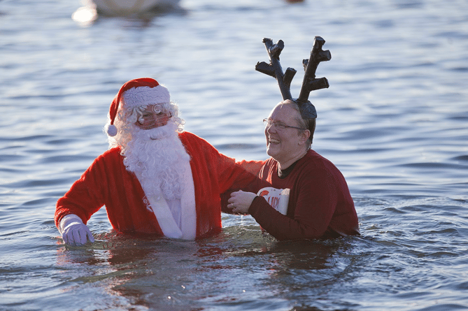 Santa taking a Christmas day swim