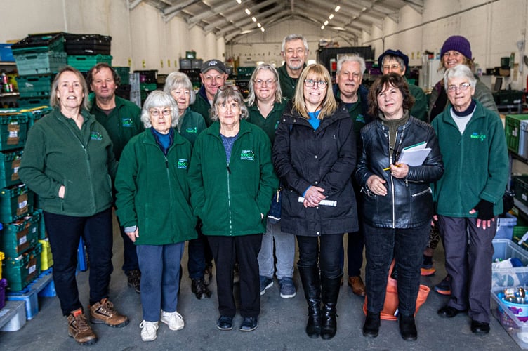 Cllr Lori Reid and Cllr Tracy Adams meeting Sharon Sissons and volunteers at the warehouse in Liskeard