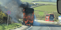 Double-decker bus fire causes A30 havoc