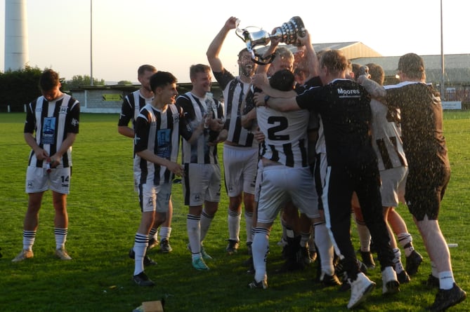 Holsworthy Reserves celebrate winning the Launceston Cup at Pennygillam on Sunday evening.