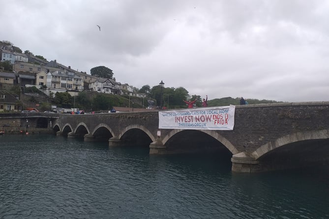 Raising awareness of the housing need in Looe is the Three Seas banner