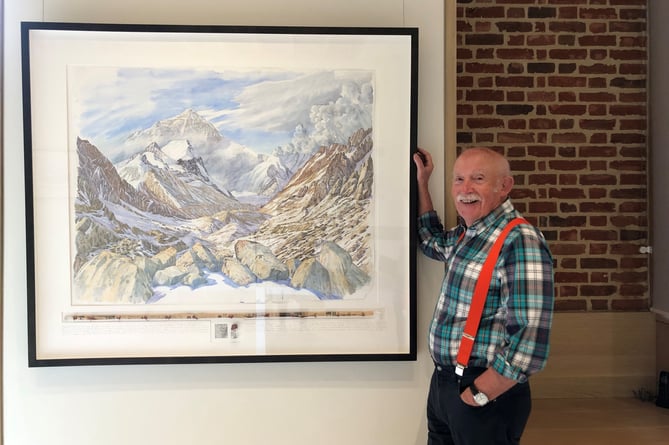 Tony Foster with one of his paintings at the exhibition.
