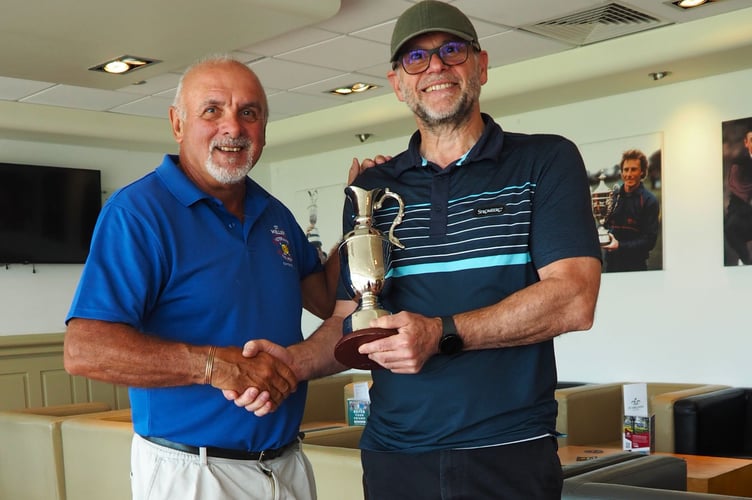 St Mellion Seniors captain Chris de Beaufort presents the Handicap Trophy to newcomer Richard Frith (right).