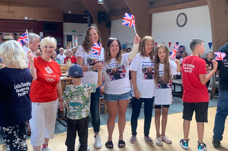 A crowd has gathered at Saltash Social Club to cheer Lola Tambling on during the Olympics