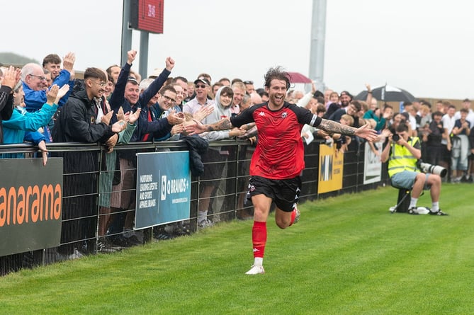 New Truro skipper Tyler Harvey celebrates his leveller against Dorking Wanderers on Saturday, the first goal in the new Truro City Stadium. Picture: Colin Bradbury