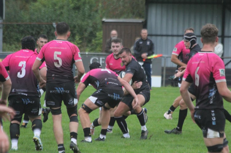 Launceston captain Tom Sandercock looks to evade the attentions of the Brixham defence. 