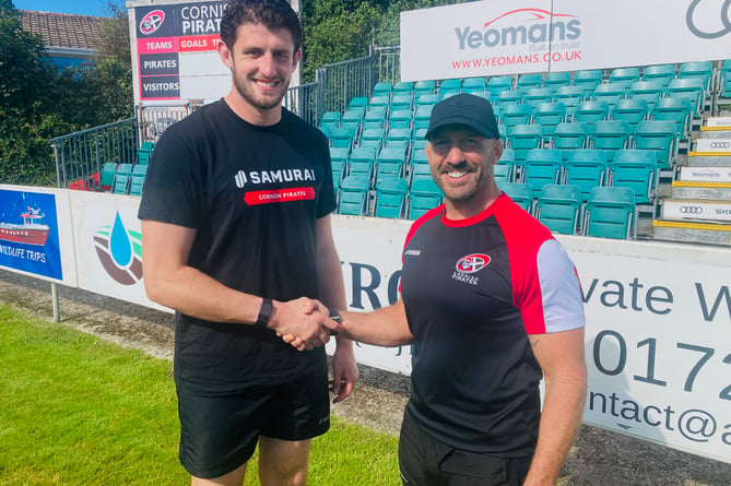 Eoin O'Connor (left) is welcomed to the Mennaye Field by Cornish Pirates' joint head coach, Alan Paver. Picture: Phil Westren