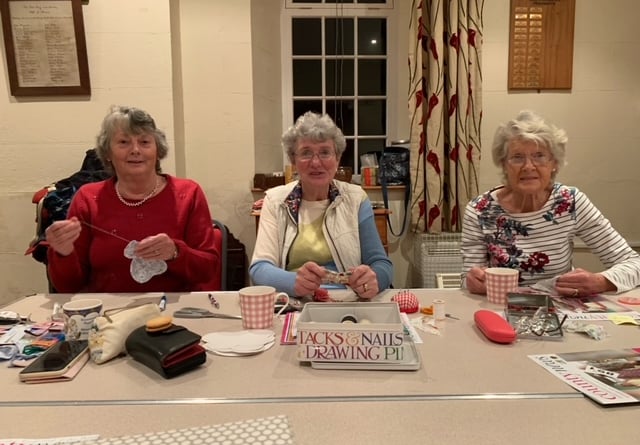 Carol Titcombe, Daphne Tucker and Vivienne Daniel enjoy a handicraft workshop at the September meeting of the Coad’s Green W.I.