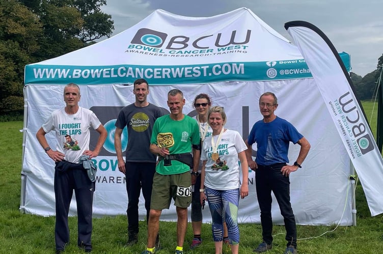 Winner Oli Jones (centre) with crew and his fellow East Cornwall Harriers' runners. From left: Gareth Price, Simon O'Hora, Rachael Young, Ali O'Hora and John Sudell. 