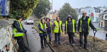 Bodmin BlueTiTs brave the rain to transform overgrown part of town 