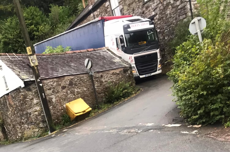 A haulage truck is awaiting recovery after getting stuck in a narrow lane at Forder. (Photo credit: Liz Wilson)