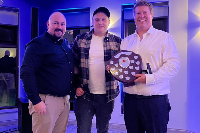 Sam Pluckrose (centre) presents the Callington Cricket Club club person of the year award - the Ted Pluckrose Cup -  to Alex Robinson (right) alongside chairman Toby Beresford-Power. Picture: Callington CC