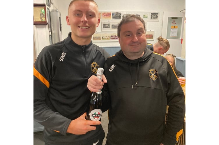 Torpoint Athletic secretary Robbie Morris presents the man of the match award to Mason Elliott. Picture: Torpoint Athletic AFC