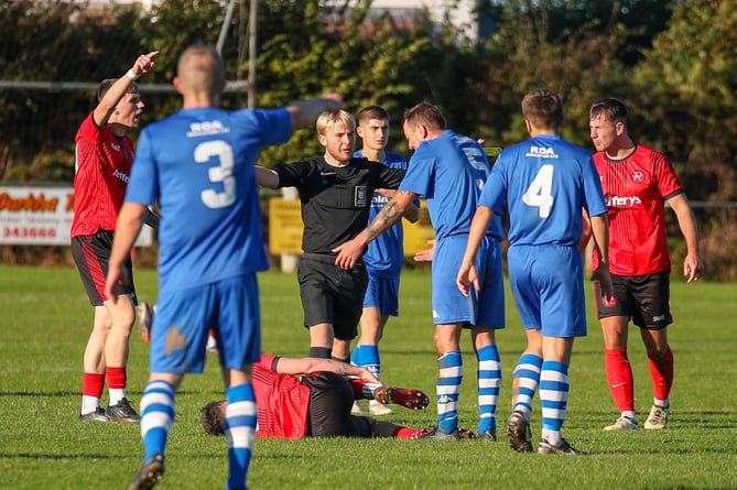 Dobwalls appeal for a free-kick during Saturday's Walter C Parson SWPL League Cup clash with Honiton Town at Lantoom Park, a tie which the visitors won 3-1. Picture: Colin Hilton