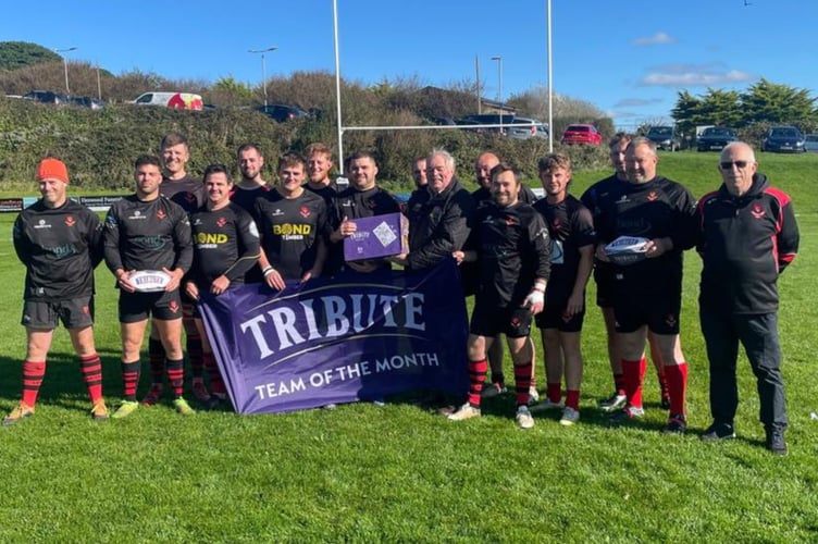 Liskeard-Looe's players and officials receive their Team of the Month award from Cornwall RFU representative, Denis Preece. Picture: Liskeard-Looe RFC