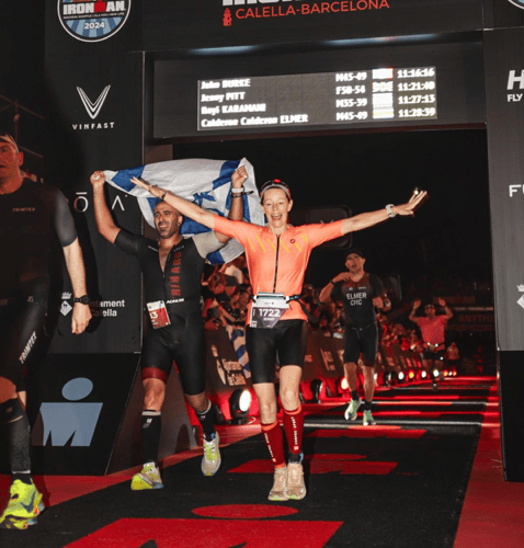 Jenny Pitt crossing the finish line