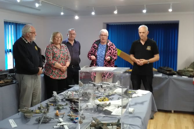 Pictured at Saltash Model Club's meeting during the presentation of a £250 cheque for memorial benches are (centre) Cllr Jean Dent, (right) chairman of Saltash Model Club David Parsons and (right) Saltash Rotary Club members