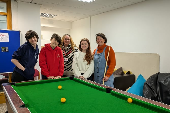 Young people at The Vault in Callington pictured with youth worker Nathalie and volunteer Ruth