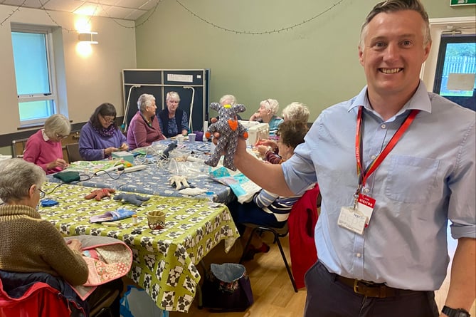 Alex Halsey with a sensory bear created by the members of Bridge View Quilters and Brunnel Quilters