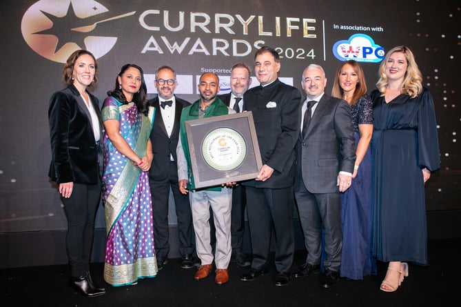 Chennai Indian Fusion from Looe receiving their awards from Lord Karan Bilimoria, founder of Cobra Beer, Rushanara Ali MP and awards host Camilla Tominey. (Picture: Curry Life Awards)