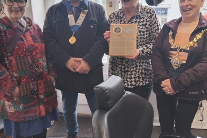 WINNER of the Halloween window competition Angie with town council members in Liskeard