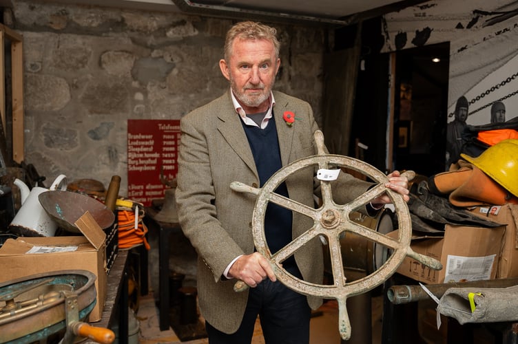 Auctioneer David Lay with Hundreds of items recovered from shipwrecks, including cannons, crockery, and other treasures as they are being put up for auction from the Shipwreck Treasure musuem, Charlestown, Cornwall. November 4th 2024.  Release date â November 5, 2024.   Coal from the Titanic is going on sale - with hundreds of items from shipwrecks including cannons and crockery.  The 700 marine artefacts dating back to the 1500s are housed at the Shipwreck Treasure Museum in Charlestown, Cornwall.  Sir Tim Smit, founder of the Eden Project, bought the museum 10 years ago and is now selling the items and the building.  The sale includes 46g of coal from onboard the Titanic, valued at Â£400 to Â£600.    