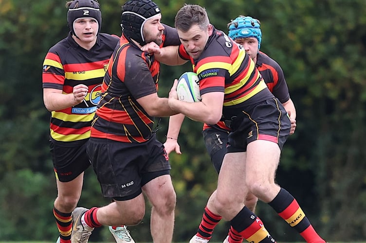 Saltash's try-scoring machine Will Morton looks to break clear of Liskeard-Looe scrum-half Callum Beaver. Picture: Glen Rogers