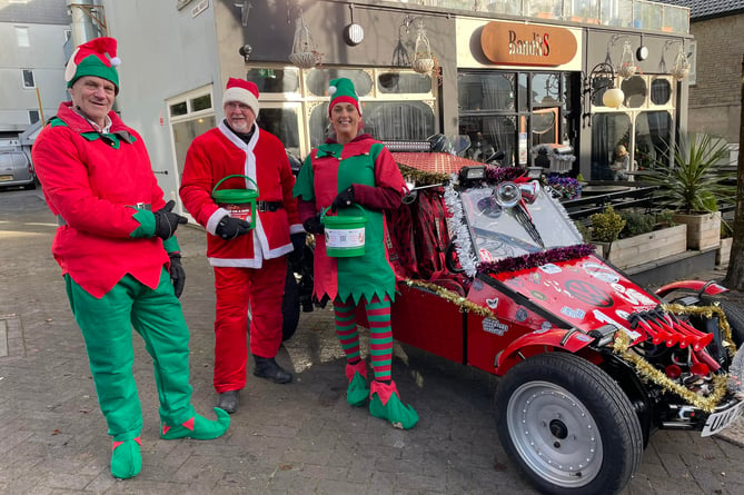 Santa and his elves preparing for this year's Saltash Christmas Festival. (Picture: Saltash Christmas Festival)