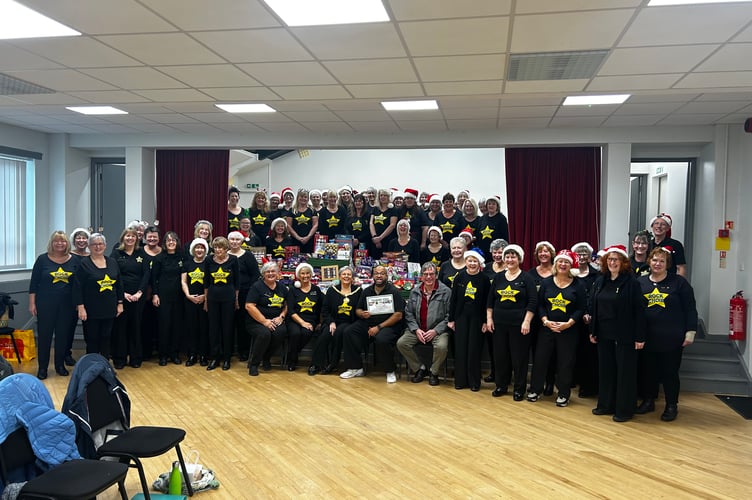 Saltash Rock Choir presented the Foodbank with items for their Christmas hampers at their last rehearsal of the term with Saltash Mayor Julia Peggs in attendance. (Picture: Julia Peggs) 