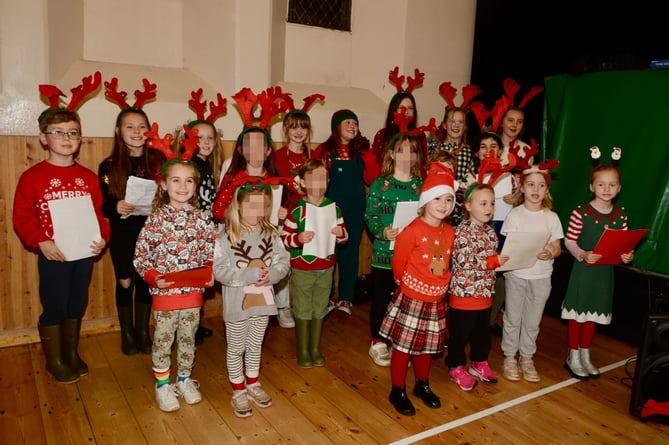 Primary School children from Fourlanesend stole the show at the Kingsand and Cawsand Christmas light switch on with their traditional carol singing. (Picture: Sue Clemens)