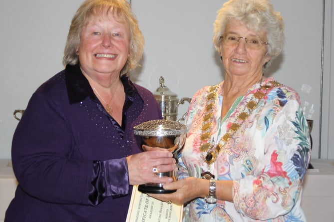 Linda Murrish presents the Alice Rose Bowl trophy to winner Pauline Sanders (left). Picture: Liskeard Bowling Club