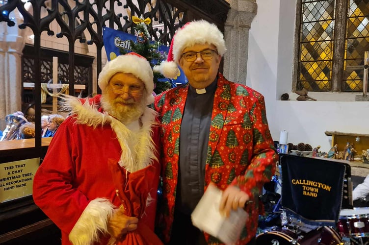 THE Reverend Andy Atkins with Santa (aka Robin West) at Callington's Christmas Tree Festival opening night