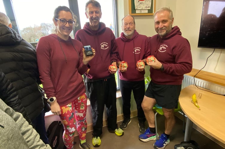 Harriet Housam with Armada Grand Prix Trophy and Steve Baker, Barry Olver and Trevor Williams from the winning over 60’s team. Richard Morton had wandered off. Picture: Tamar Trotters