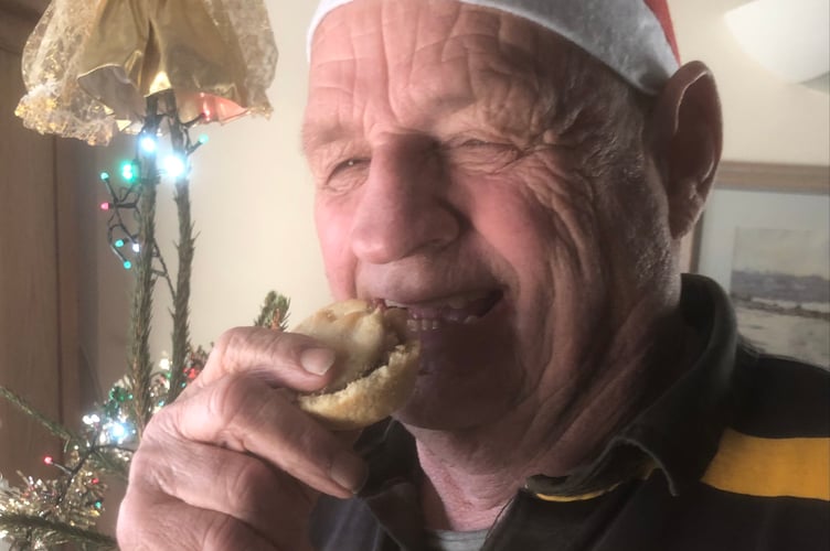 Jim Candy, Cornwall councillor for Looe West, Pelynt, Lansallos and Lanteglos, enjoying a festive treat