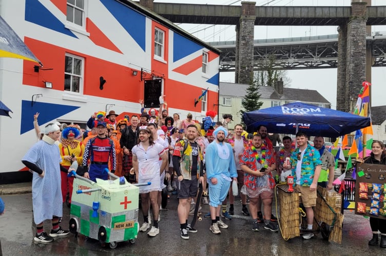 Participants in the annual Saltash RFC Pram Race outside of the Union Inn on New Year's Day