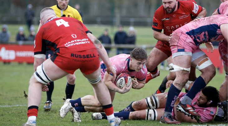 Exeter Chiefs scrum-half Tom Cairns dives over for a try in his side's Premiership Rugby Cup win over Hartpury