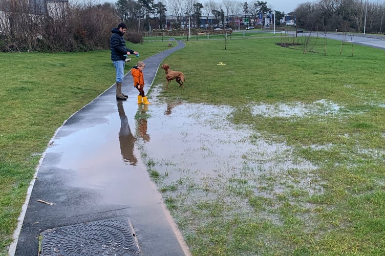 Wellies are required to access the waterlogged playpark at Treledan after the storms with residents saying it's a common sight. (Picture: Sarah Martin)