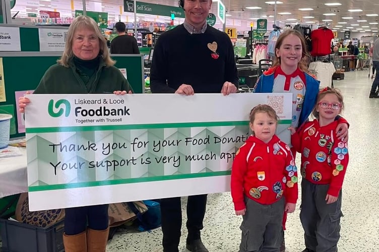 Members of the 1st Liskeard Rainbows teamed up with the Liskeard & Looe Foodbank at Morrisons Supermarket to help boost their stock levels