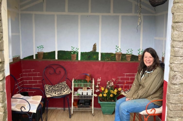 Sarah Worne sitting in the bus stop after finishing her latest design. The 'world's coolest bus stop' has been given its latest makeover - by locals who have been doing it up for 20 years. The Fowey Pretty Bus Stop on Lankelly Lane in Cornwall has been decorated and painted by residents for two decades. It was given its first makeover by Jane Tinsley - after it became a target for anti-social behaviour. Over the next 20 years the stop it has been decorated as a tea room, a yacht race, and last year celebrated the 200th anniversary of the RNLI. 