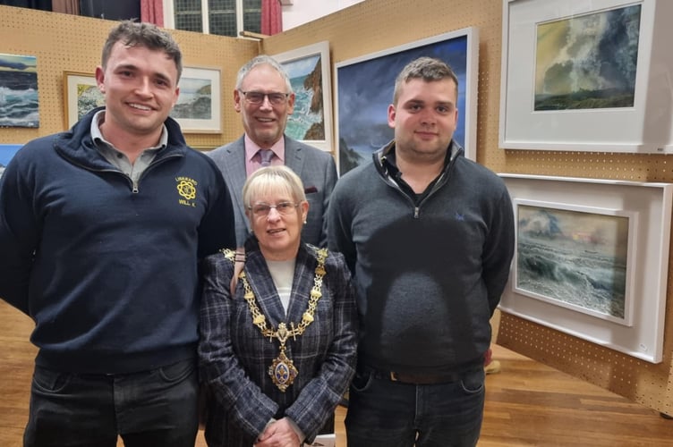 Will Kitto and Will Lethbridge of Liskeard Young Farmers Club, flank town mayor Christina Whitty and her husband Terry at the opening of the 56th Arts and Crafts Exhibition in aid of Cancer Research UK