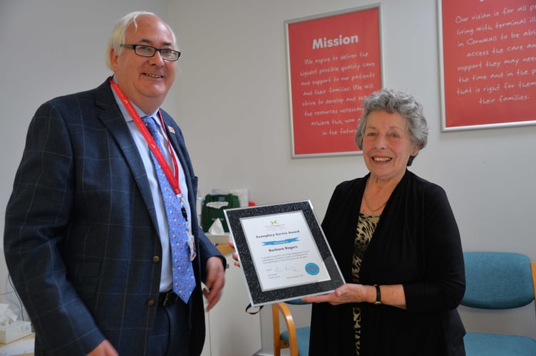 Cornwall Hospice Care CEO Paul Brinsley presents Barbara Rogers with her Exemplary Service Award