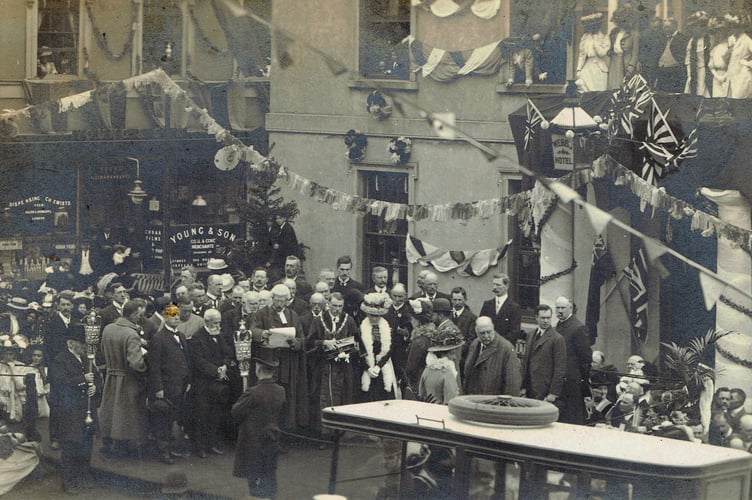 In 1909, the Prince and Princess of Wales are pictured outside Webb's Hotel, with Young & Son in the background