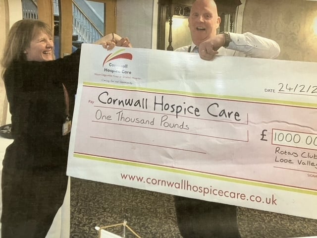 The Rotary Club of Looe Valley president David Bunt presenting Kelly Tregaskis of Cornwall Hospice Care with a £1,000 cheque to go towards their care costs