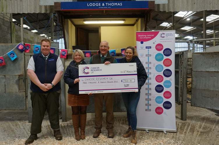 Andrew Pedrick with representatives from Cancer Research UK and Truro auctioneers Lodge and Thomas